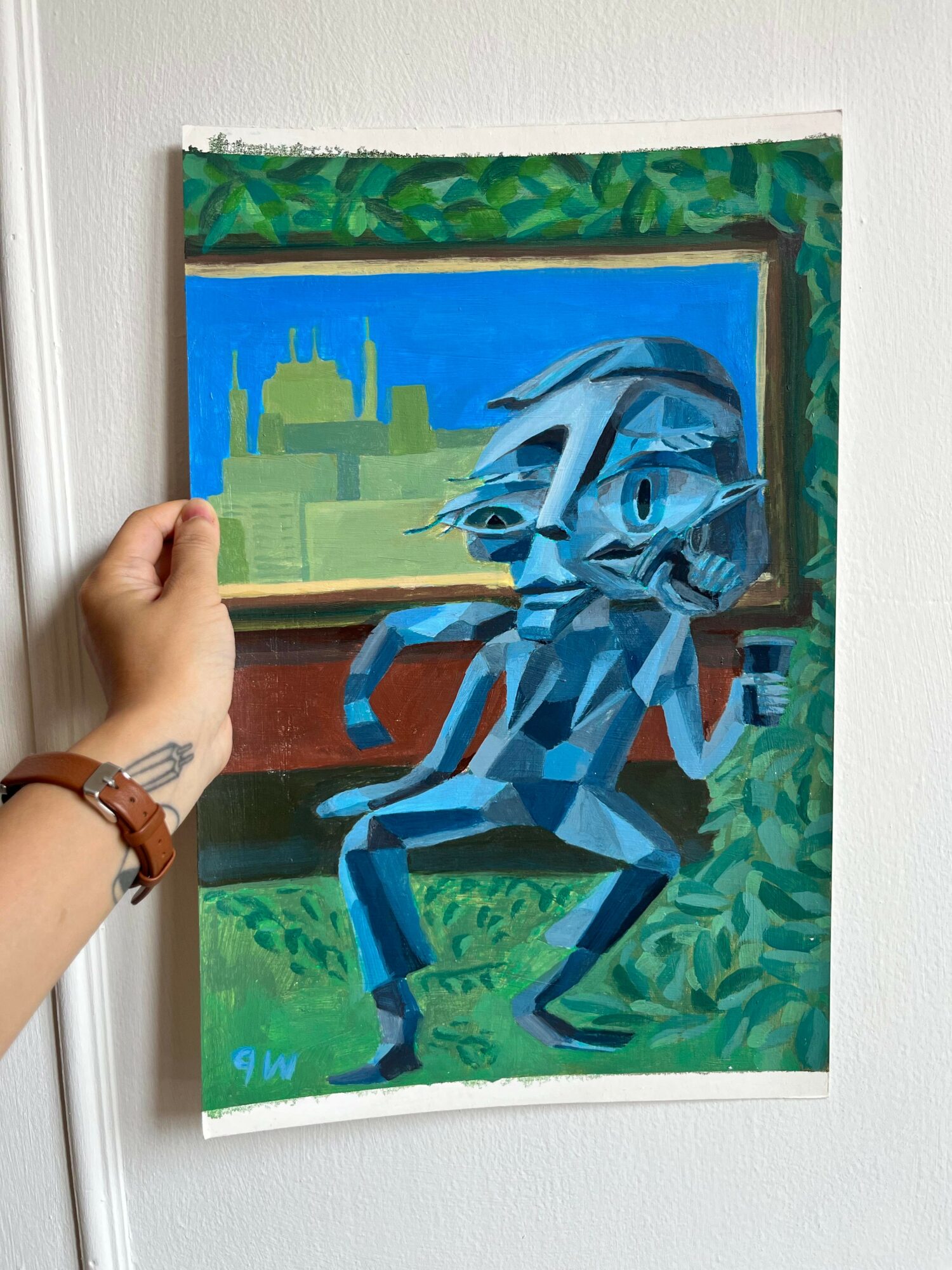 Painting depicts a blue, geometric humanoid figure sitting on a bench with a cityscape and greenery in the background.