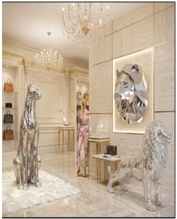 Interior with chandeliers, a large diamond artwork, and metallic animal sculptures, including a horse and a dog, in a luxurious setting.