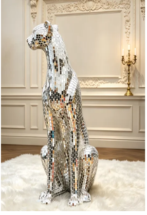 Mirror mosaic horse sculpture in a room with ornate wall details and a candelabra, standing on a white rug.